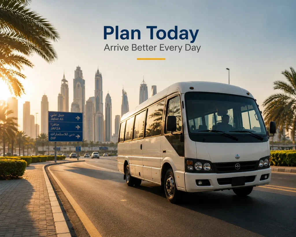 White passenger bus travelling on a Dubai road toward Jebel Ali, JAFZA, and DIP during the morning commute.